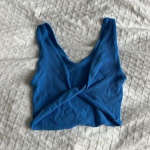 out from under blue tank top